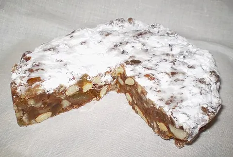 panforte: a dense flat cake, a speciality of Siena, made with honey, hazelnuts, almonds, candied fruit, cocoa...