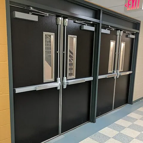panic door: a door fitted with a panic bar