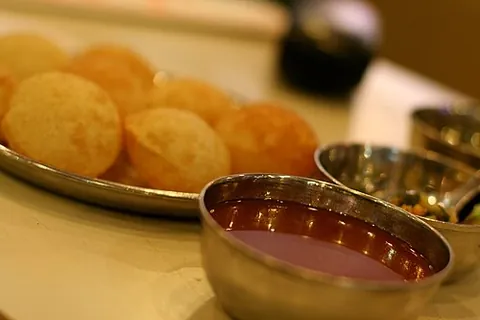 panipuri: a form of fried puff-pastry balls filled with a watery mixture of tamarind, chili, chaat masala,...