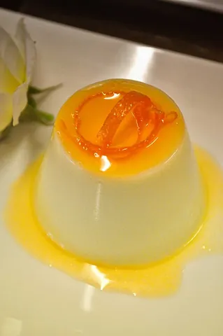 panna cotta: a northern Italian dessert consisting of flavoured double cream set with gelatine, often served...