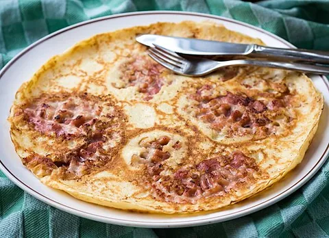 pannekoek: a form of Dutch pancake, being thin and wide and optionally made with apples or a variety of other...