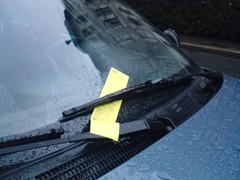 parking ticket: a legal summons issued for parking a motor vehicle in a place where such parking is restricted, or...