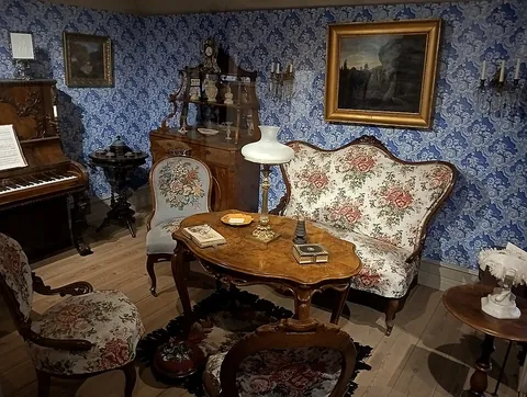 parlor: the living room of a house, or a room for entertaining guests; a room for talking; a sitting-room...
