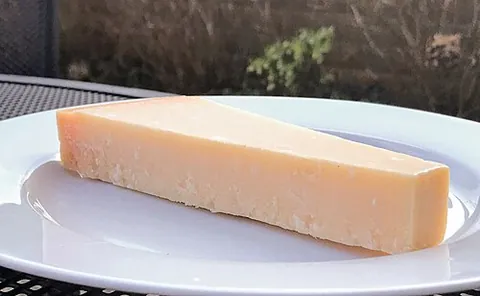 parmesan: a hard, full-fat Italian cheese from Parma or its neighboring province Reggio Emilia