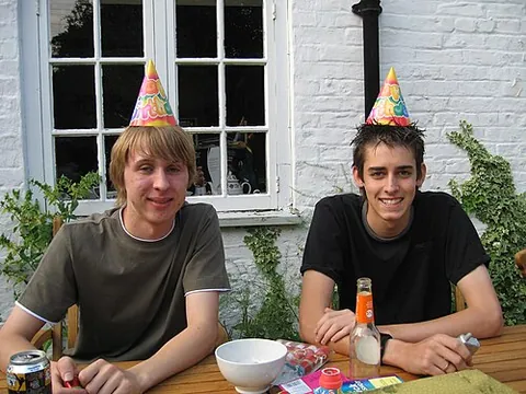 party hat: a simple hat worn at parties, usually conical and made of cardboard