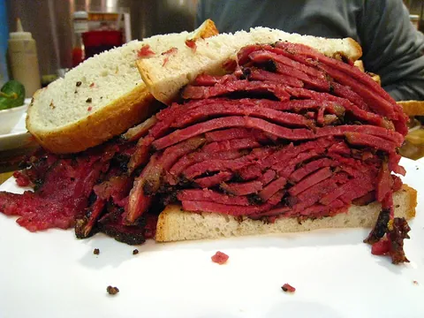 pastrami: a seasoned smoked cut of beef, traditionally made from a navel cut