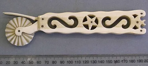 pastry wheel: a culinary tool for cutting pastry. It takes the form of a handle that bears a wheel, commonly with...