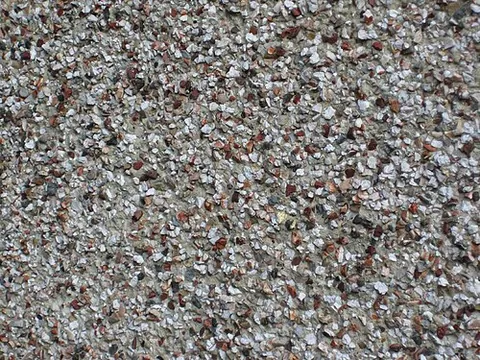 pebble dash: a coating of small pebbles sprayed onto soft plaster or cement, used as decoration on exterior walls