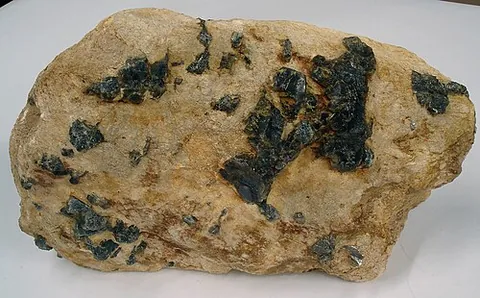 pegmatite: a coarsely crystalline igneous or plutonic rock composed primarily of feldspar and quartz, normally...