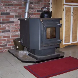 pellet stove: a stove that burns compressed wood or biomass pellets