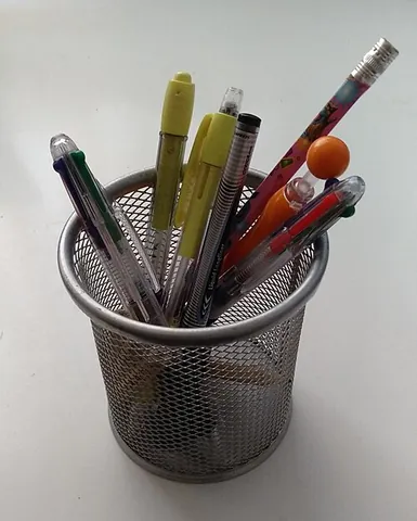 pencil holder: a small opened container for stationery such as pencils, ballpoint pens, rubber, correction fluid,...