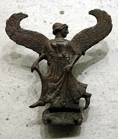 peplum: a peplos, an Ancient Greek garment formed of a tubular piece of cloth folded back upon itself...
