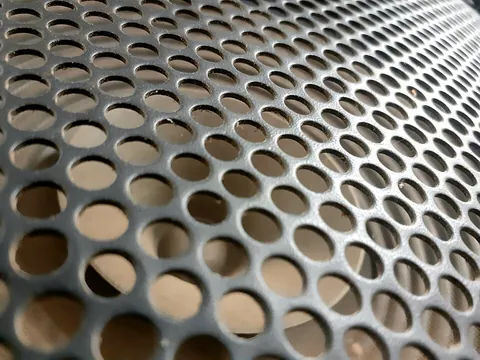 perforation: the act of perforating or the state of being perforated