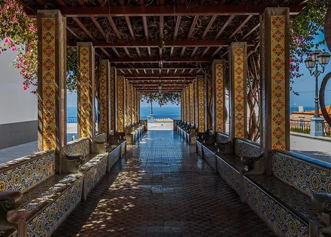 pergola: a framework in the form of a passageway of columns that supports a trelliswork roof; used to...