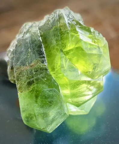 peridot: a transparent olive green form of olivine, used as a gem