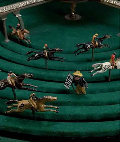 petits-chevaux: a gambling game played with a mechanical device consisting of a board perforated with a number of...