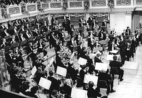 philharmonic: appreciative of music, but especially to its performance; devoted to music