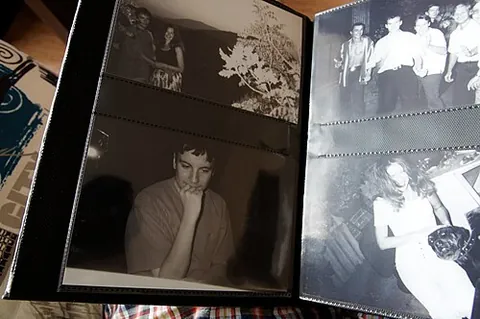 photo album: a blank book in which a collection of photographs can be mounted