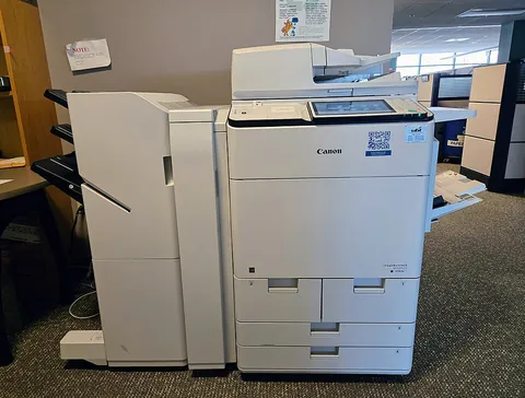 photocopier: a machine which reproduces documents by photographing the original over a glass plate and printing...