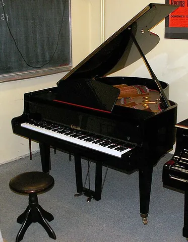 piano stool: a round wooden stool used by piano players. It is less stable than the rectangular piano bench. The...