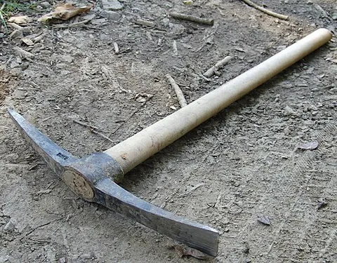 pick: a tool used for digging; a pickaxe