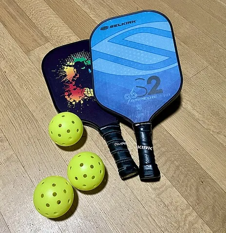 pickleball: a racquet sport resembling tennis, played with solid paddles and a perforated ball, which combines...