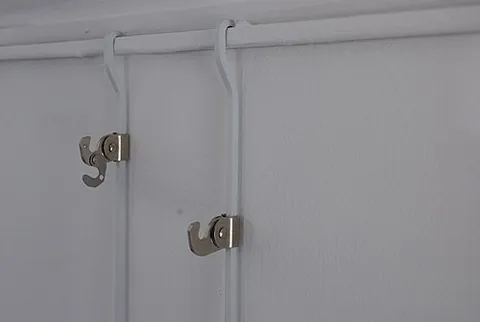 picture rail: a molding applied to or recessed into the surface of a wall, and used to suspend hooks and cables...
