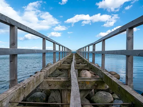 pier: a raised platform built from the shore out over water, supported on piles; used to secure, or...