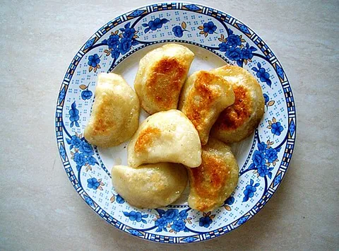 pierogi: a square- or crescent-shaped dumpling of unleavened dough, stuffed with sauerkraut, cheese, mashed...