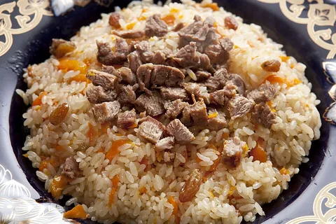 pilaf: a dish made by browning grain, typically rice, in oil and then cooking it with a seasoned broth, to...