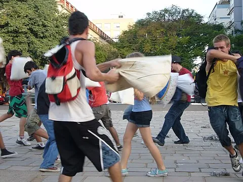 pillow fight: a play fight that involves hitting others with pillows