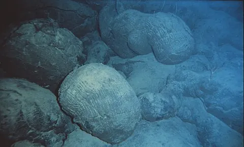 pillow lava: the rock type, resembling pillows, typically formed when lava emerges from an underwater volcanic...
