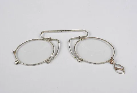 pince-nez: templeless eyeglasses that clip to the bridge of the nose