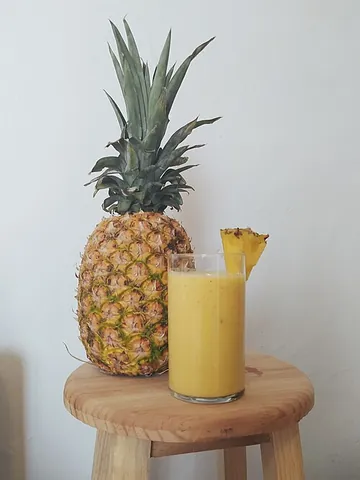 pineapple juice: the juice of pineapples; used as a beverage or in cocktails, e.g. piña colada