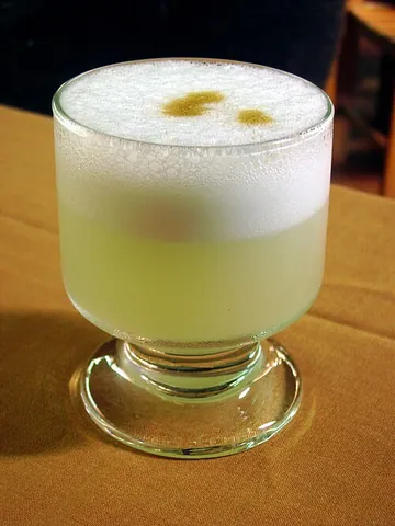 pisco sour: a Peruvian cocktail containing pisco, lemon or lime juice, egg whites, simple syrup, and bitters