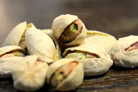 pistachio: a deciduous tree (Pistacia vera) grown in parts of Asia for its drupaceous fruit