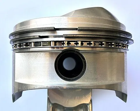 piston ring: a ring or seal that fits around a piston, sealing between the piston and the bore in which it slides