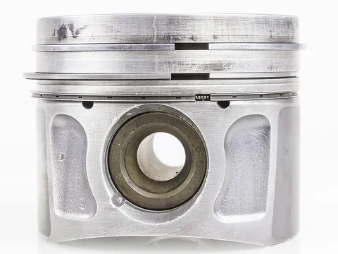 piston: a solid disk or cylinder that fits inside a hollow cylinder, and moves under pressure (as in an...