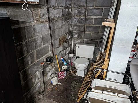 pittsburgh potty: a lone toilet, typically situated in the middle of a basement, without the amenities or privacy of...