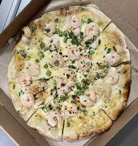 pizza bianca: an Italian flatbread that is not topped with tomato sauce, and seasoned with olive oil and salt