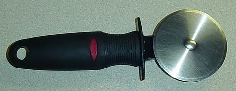 pizza cutter: a wheel-bladed knife used for cutting pizzas
