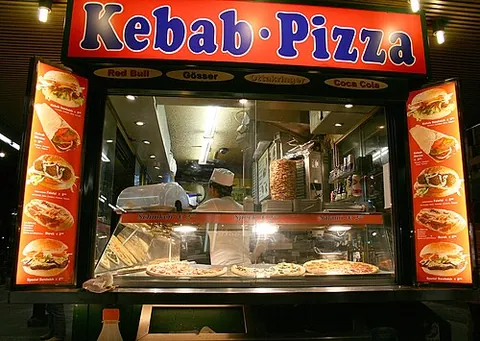pizzeria: a restaurant that bakes and sells pizzas