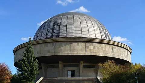 planetarium: a display museum in which images of stars and other astronomical phenomena are projected onto a...