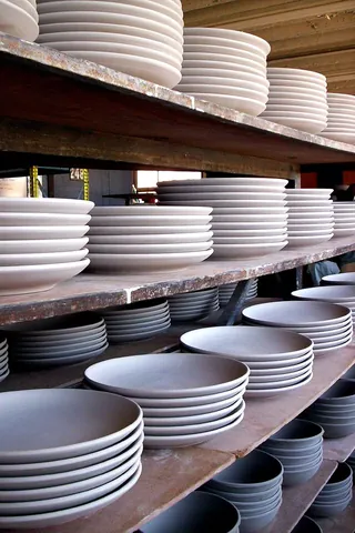 plate: a slightly curved but almost flat dish from which food is served or eaten