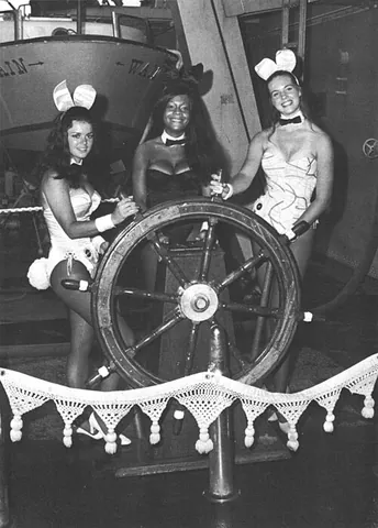 playboy bunny: a waitress at a Playboy Club, characteristically dressed in a strapless teddy, black pantyhose,...