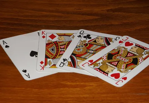 playing card: a piece of specially prepared card stock or thin material bearing identifying symbols such as a...