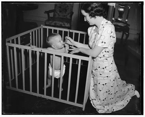playpen: an enclosure in which babies or small children can play