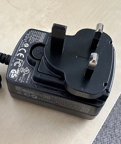 plug: a pronged connecting device which fits into a mating socket, especially an electrical one