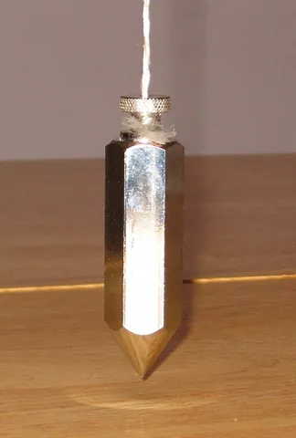 plumb bob: a metal weight attached to the end of a plumb line