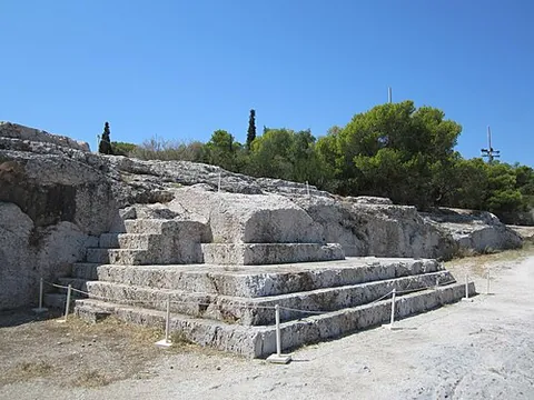 pnyx: a hill in Athens west of the Acropolis with a stone platform and steps set into its side, which was...